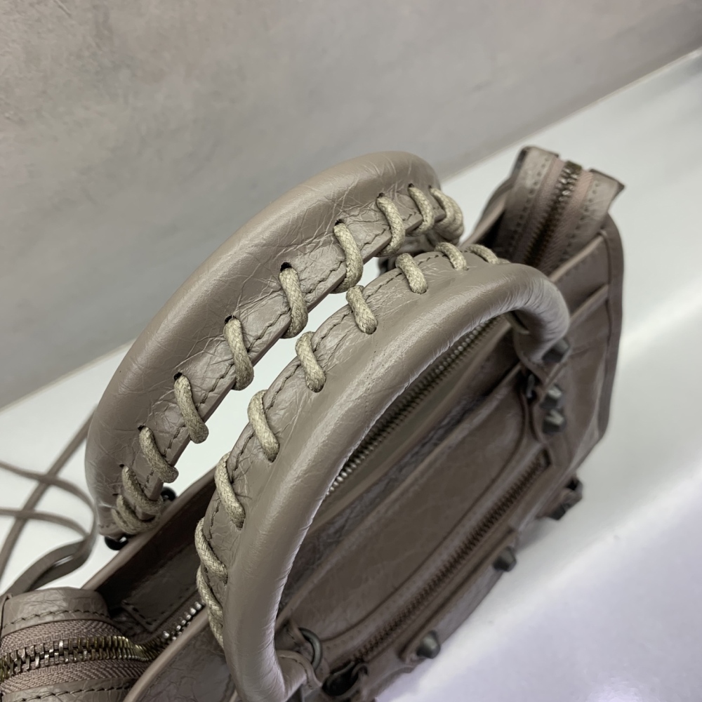 The Balenciaga Classic City Mini Motorbike Bag (Elephant Grey) is a mini version of the brand's classic motorcycle bag.