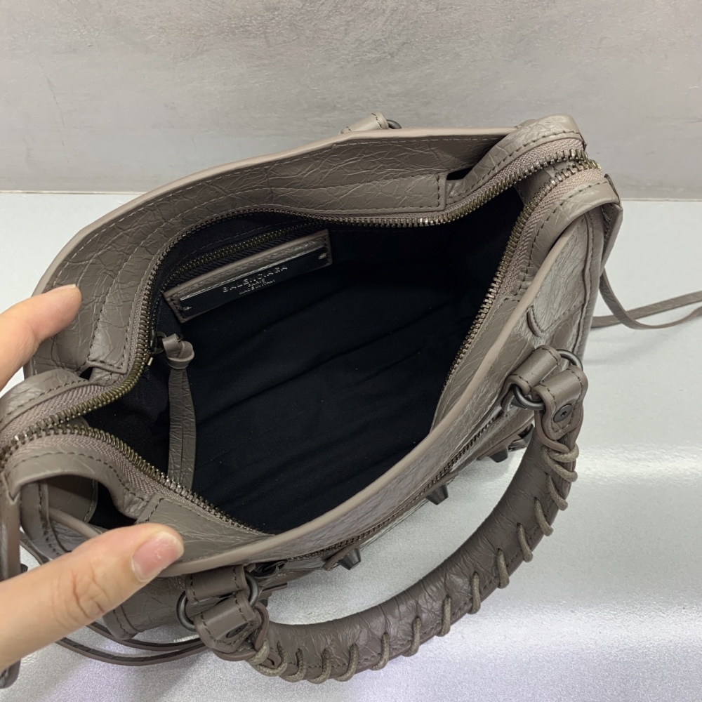 The Balenciaga Classic City Mini Motorbike Bag (Elephant Grey) is a mini version of the brand's classic motorcycle bag.
