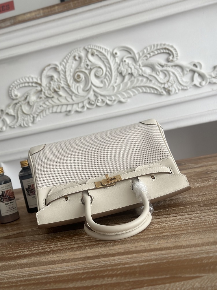 The classic Hermès Birkin bag, specifically the Birkin 25 canvas and leather version, is a popular Hermès "patchwork/canvas and leather" version.