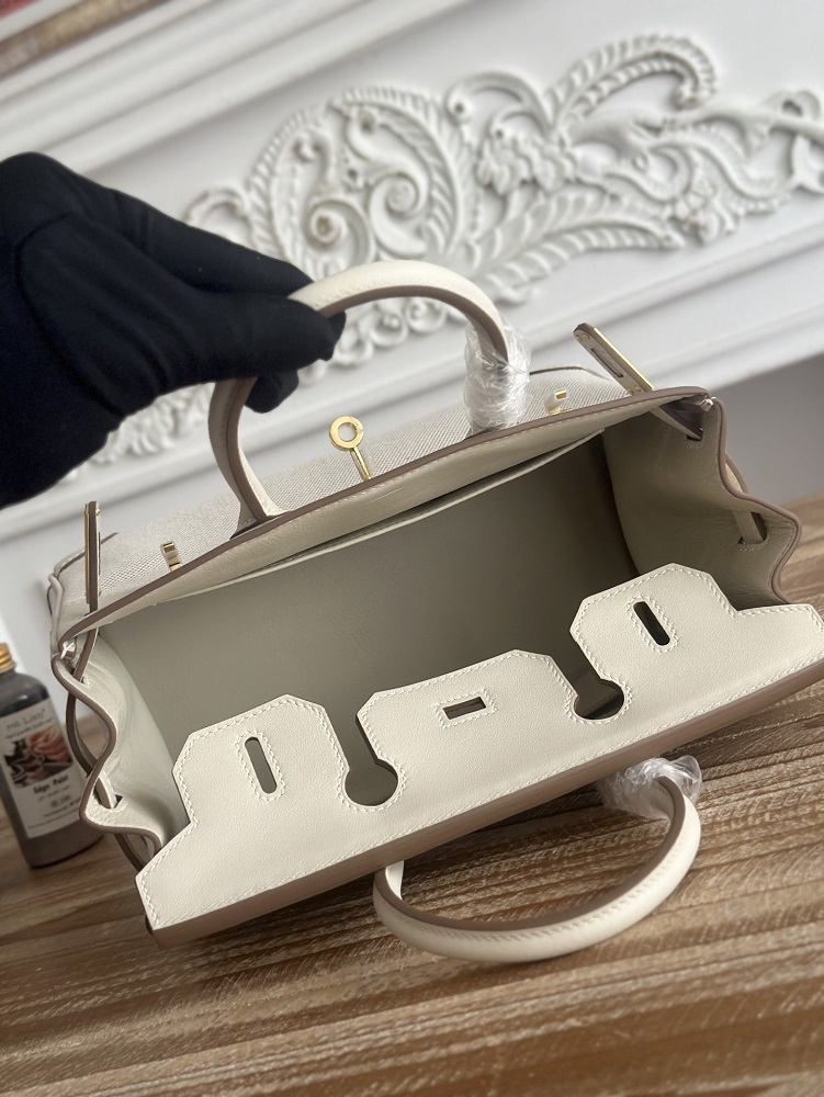 The classic Hermès Birkin bag, specifically the Birkin 25 canvas and leather version, is a popular Hermès "patchwork/canvas and leather" version.