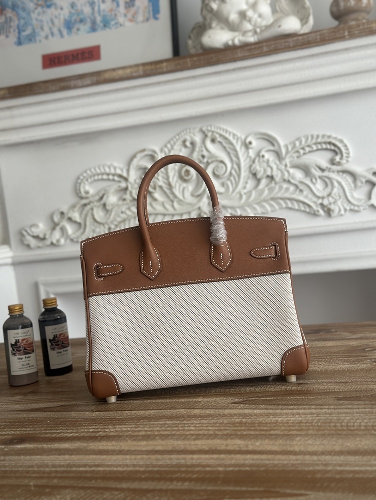 The limited/special edition Hermès Birkin bag, specifically the **"Horse Totem" canvas and calfskin Birkin**, is a highly distinctive version from Hermès.