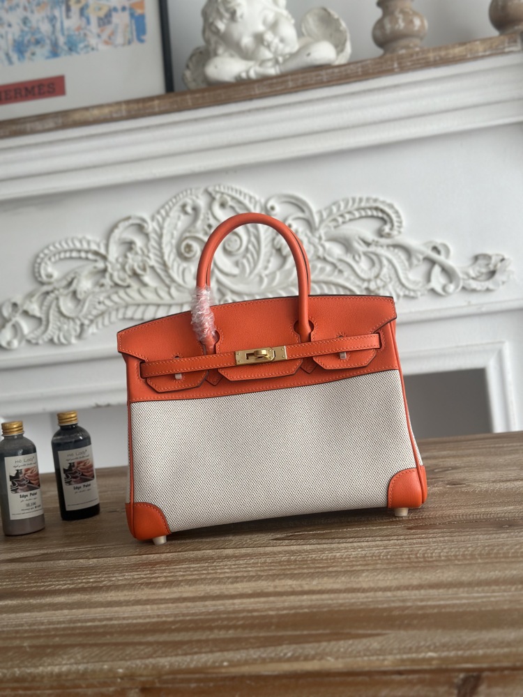 This canvas and leather tote bag, designed based on the Hermès Birkin bag, is also from the same series as your previous two bags.