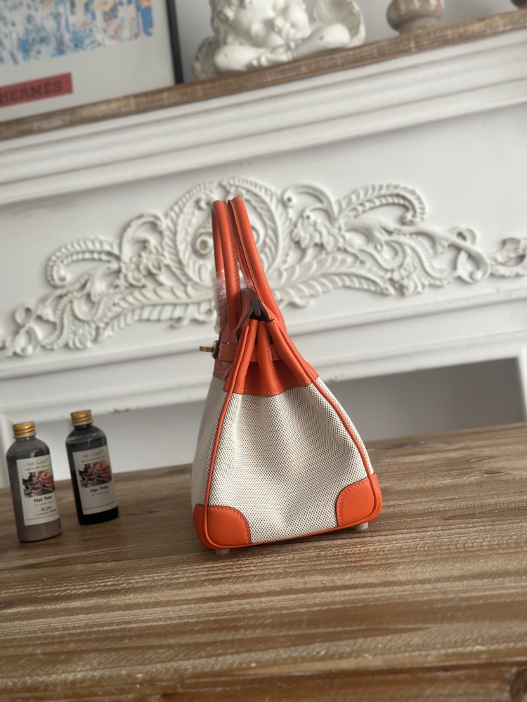 This canvas and leather tote bag, designed based on the Hermès Birkin bag, is also from the same series as your previous two bags.