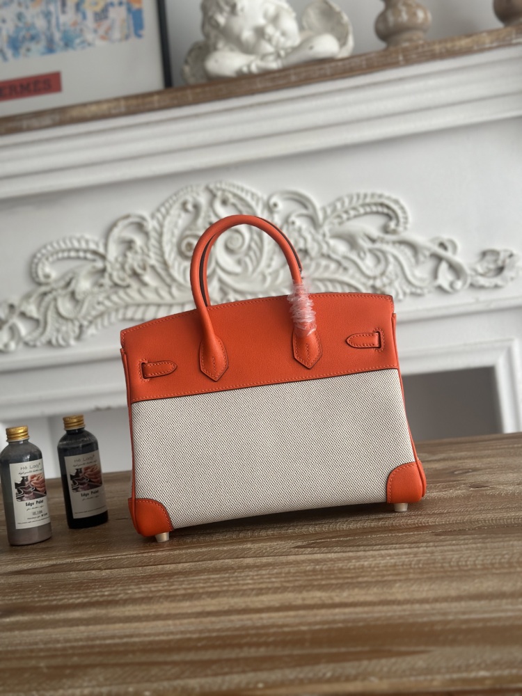 This canvas and leather tote bag, designed based on the Hermès Birkin bag, is also from the same series as your previous two bags.