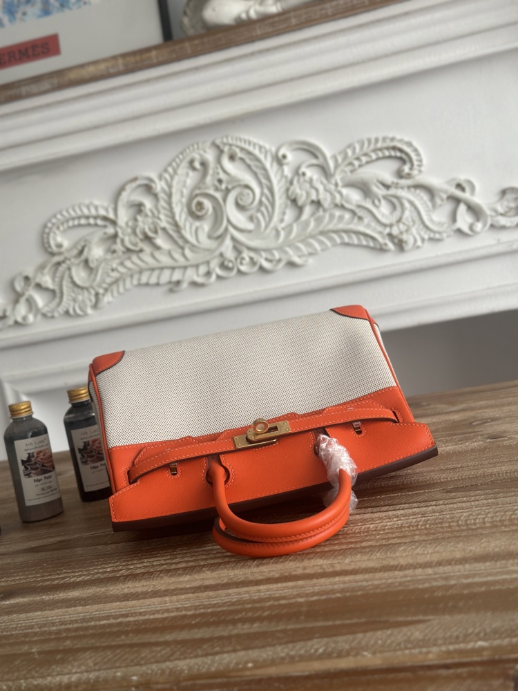 This canvas and leather tote bag, designed based on the Hermès Birkin bag, is also from the same series as your previous two bags.