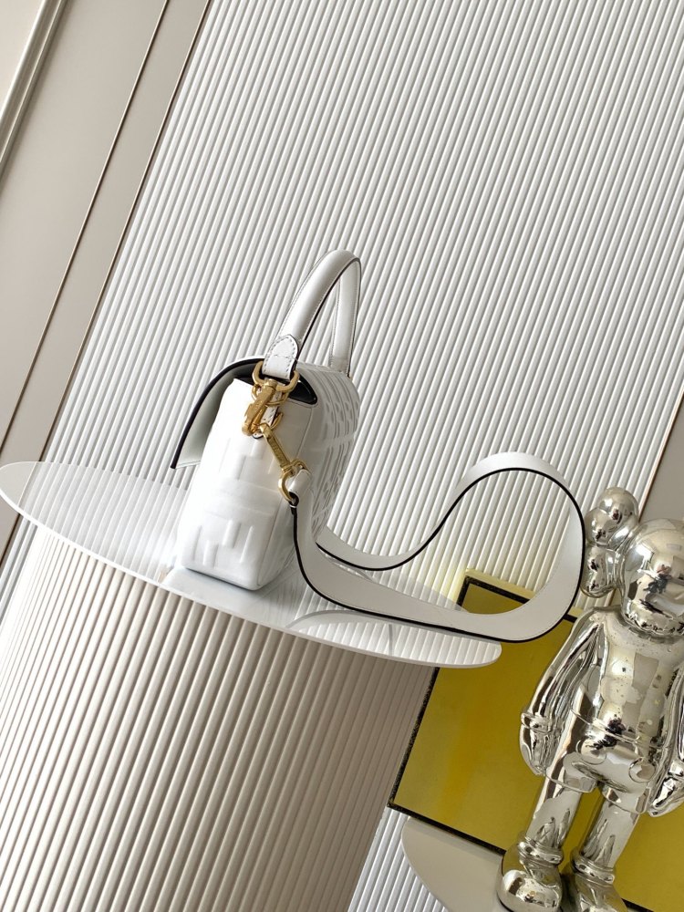 The Fendi classic Baguette bag (white with embossed FF logo) is the brand's iconic retro underarm bag.