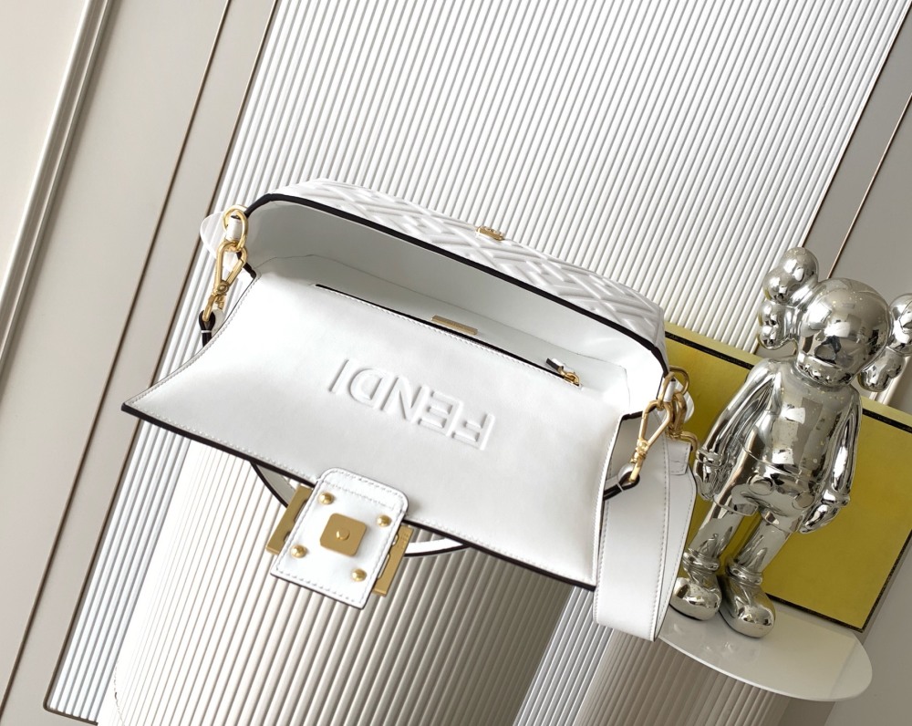 The Fendi classic Baguette bag (white with embossed FF logo) is the brand's iconic retro underarm bag.