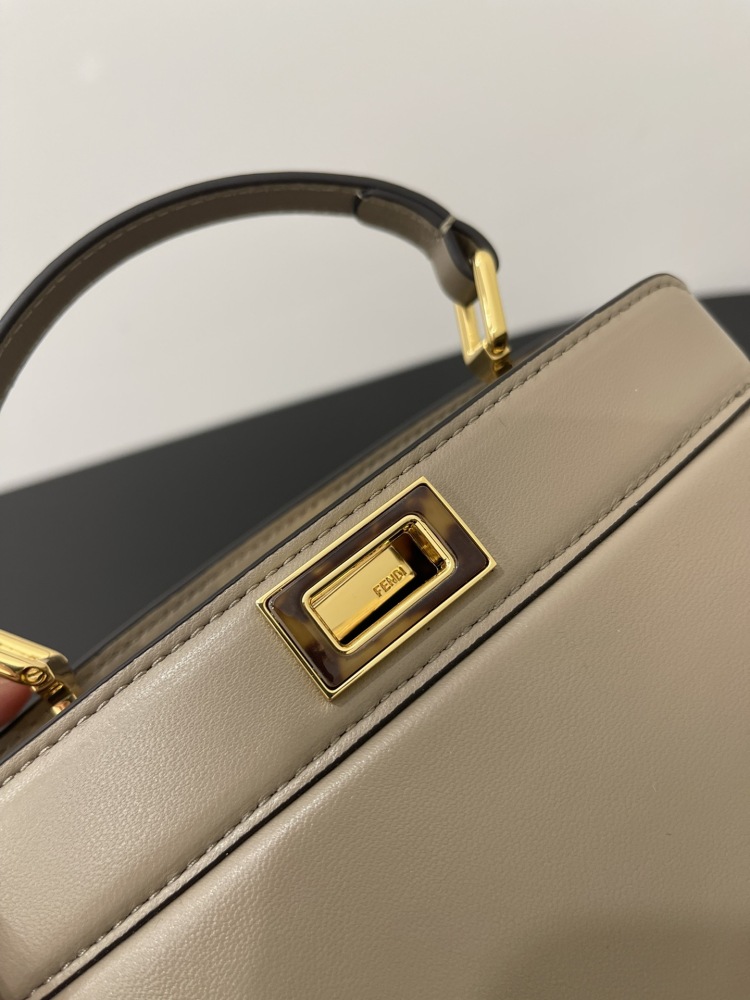 The Fendi Peekaboo mini handbag (elephant grey) is the brand's iconic "little monster" bag.