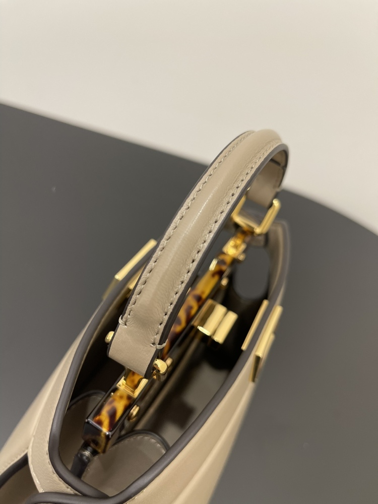 The Fendi Peekaboo mini handbag (elephant grey) is the brand's iconic "little monster" bag.