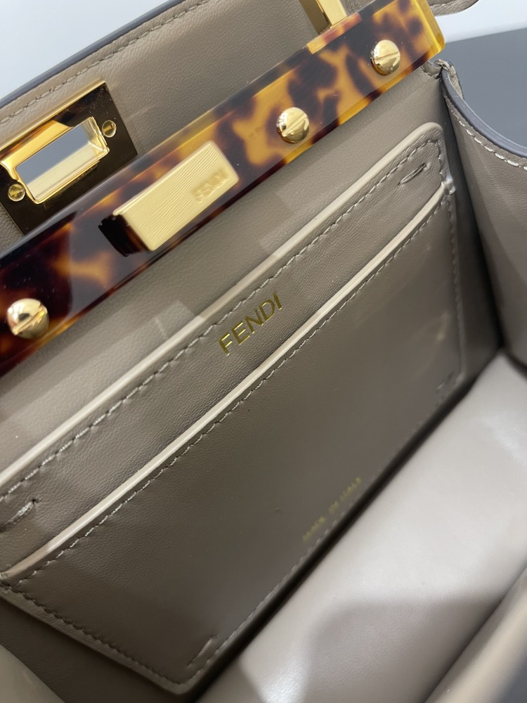 The Fendi Peekaboo mini handbag (elephant grey) is the brand's iconic "little monster" bag.