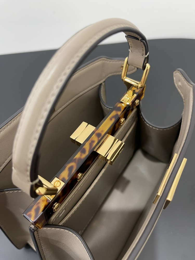 The Fendi Peekaboo mini handbag (elephant grey) is the brand's iconic "little monster" bag.