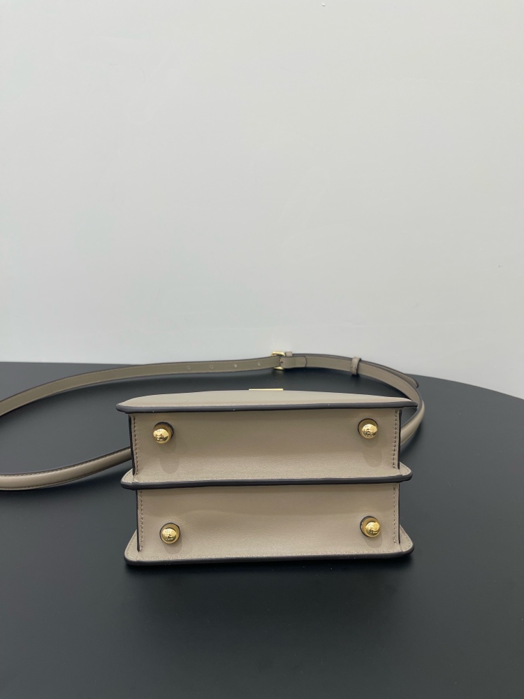 The Fendi Peekaboo mini handbag (elephant grey) is the brand's iconic "little monster" bag.