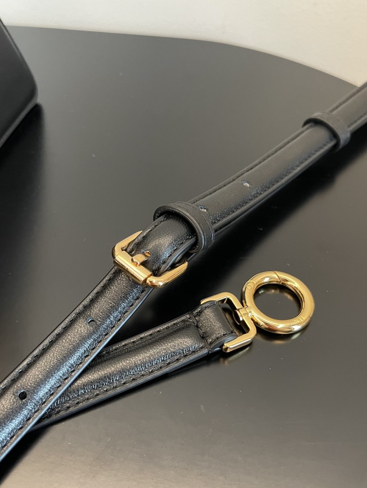 The Fendi Peekaboo mini handbag (navy/black) is the brand's iconic "little monster" bag.