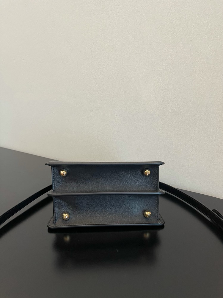 The Fendi Peekaboo mini handbag (navy/black) is the brand's iconic "little monster" bag.