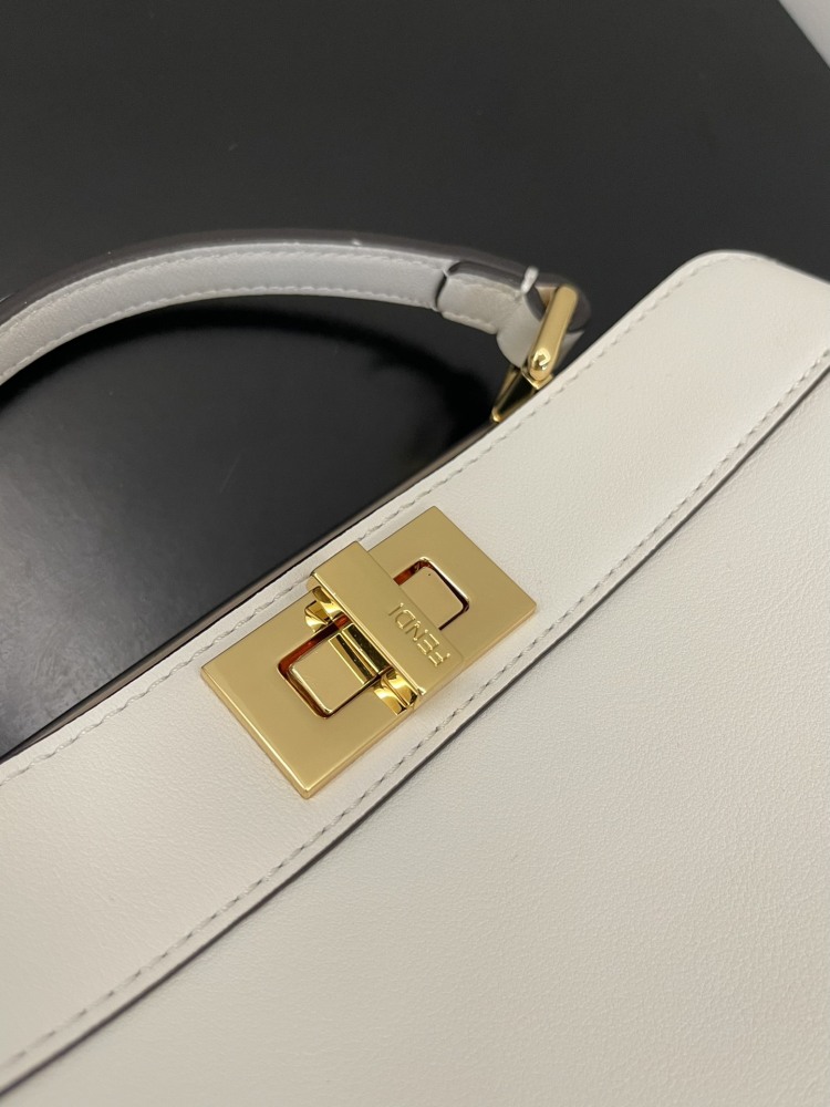 The Fendi Peekaboo mini handbag (off-white) is the brand's iconic "little monster" bag.