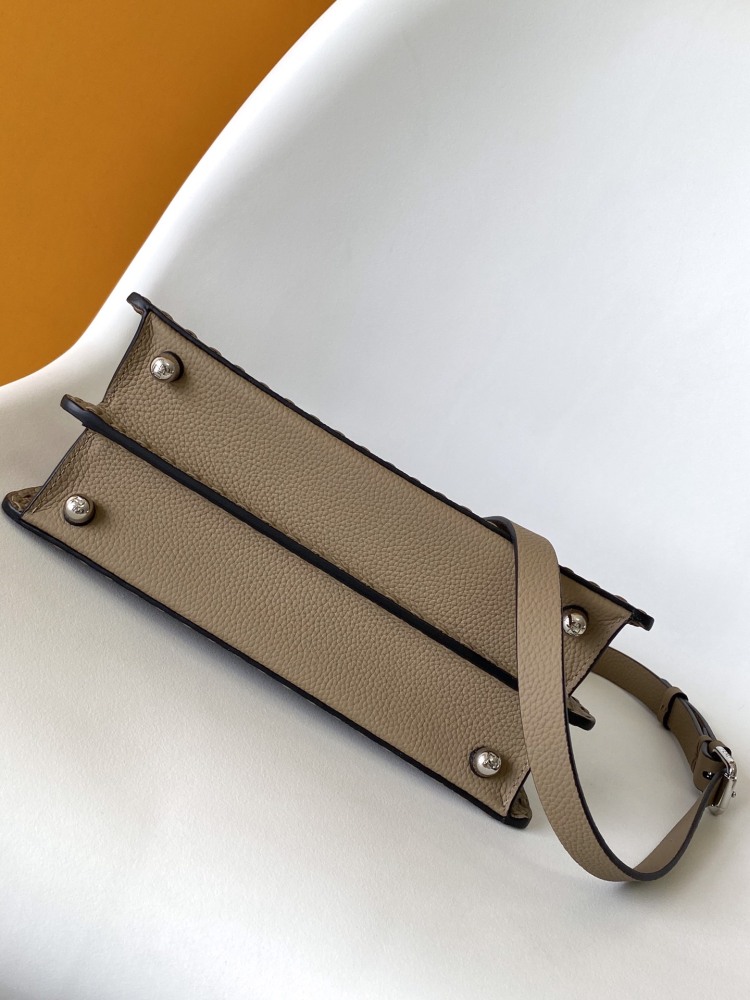 The Fendi Peekaboo medium handbag (in elephant grey/truffle grey Roman stitching) is a premium version of the brand's iconic "little monster" bag.