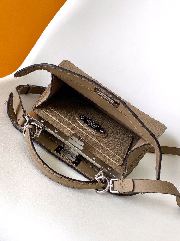 The Fendi Peekaboo medium handbag (in elephant grey/truffle grey Roman stitching) is a premium version of the brand's iconic "little monster" bag.