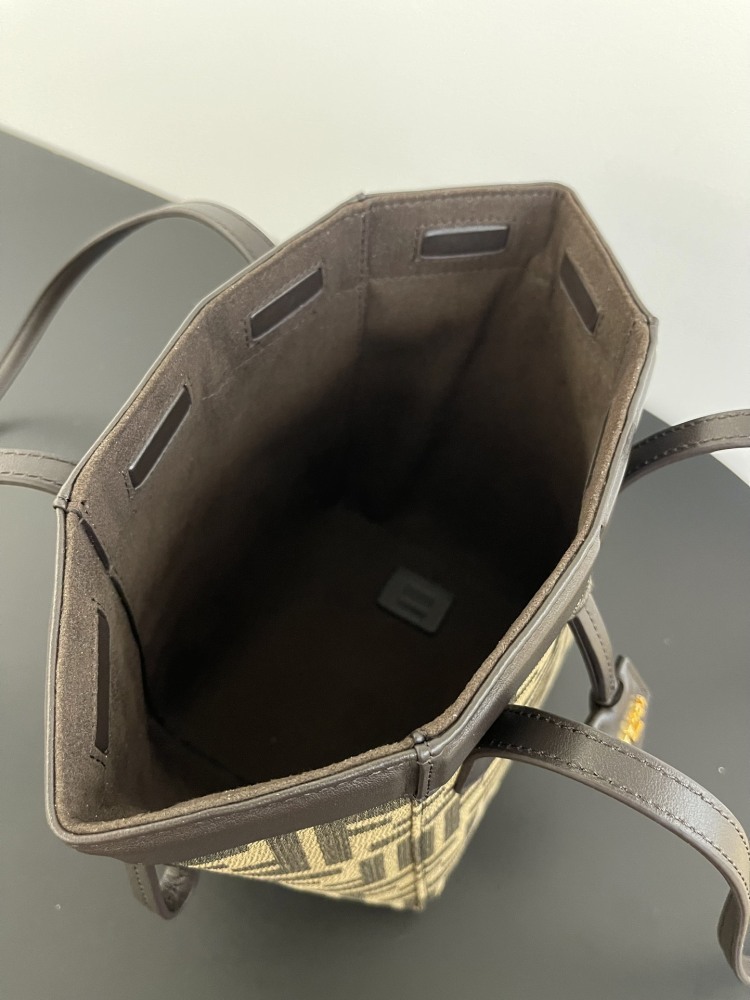 The Fendi Roll mini tote bag (FF monogram version) is a super popular "mini bucket" commuter bag from the brand in recent years.