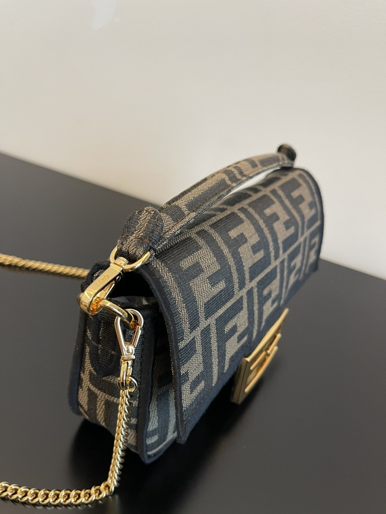 The Fendi classic Baguette bag (FF monogram mini version) is the brand's iconic retro underarm bag.