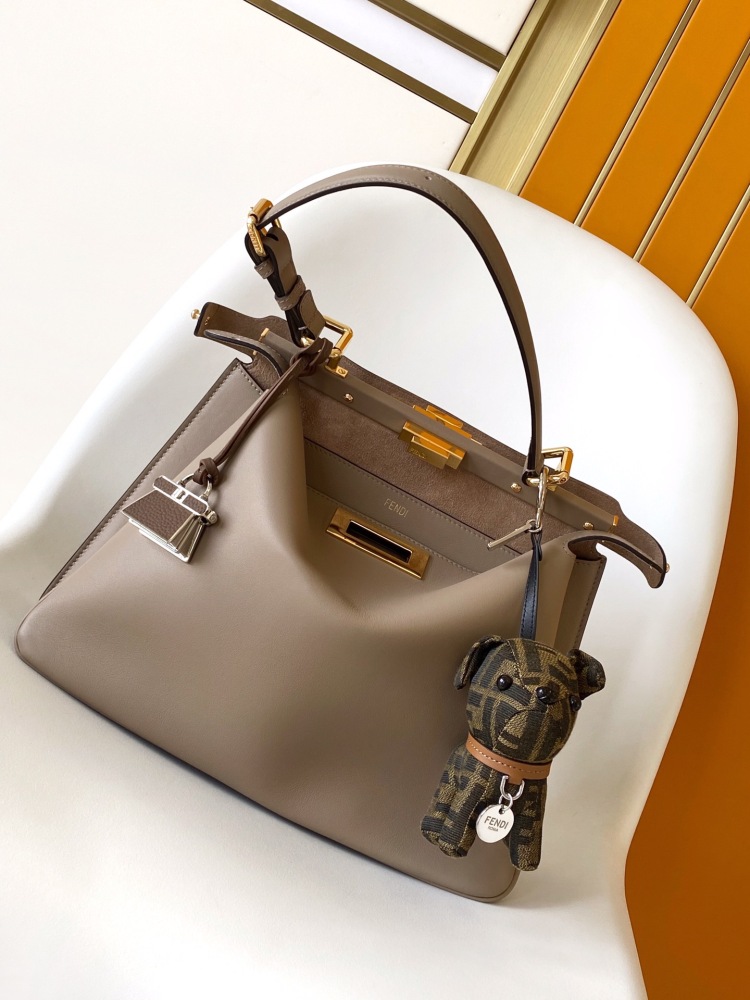 The Fendi Peekaboo medium-sized handbag (elephant grey) is the brand's iconic "little monster" bag.