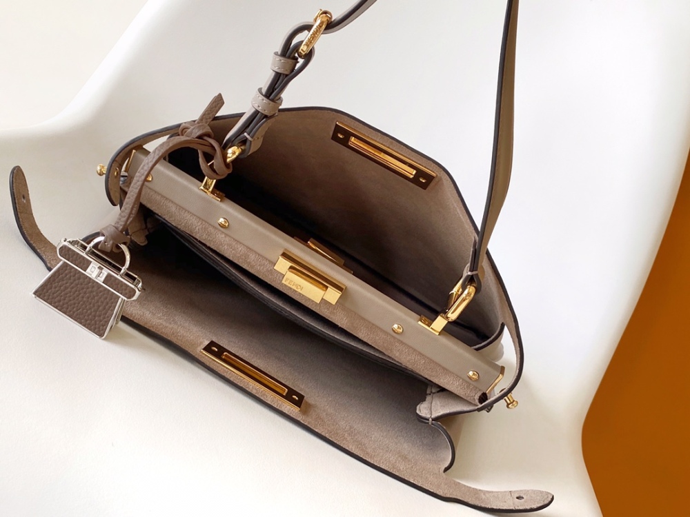 The Fendi Peekaboo medium-sized handbag (elephant grey) is the brand's iconic "little monster" bag.