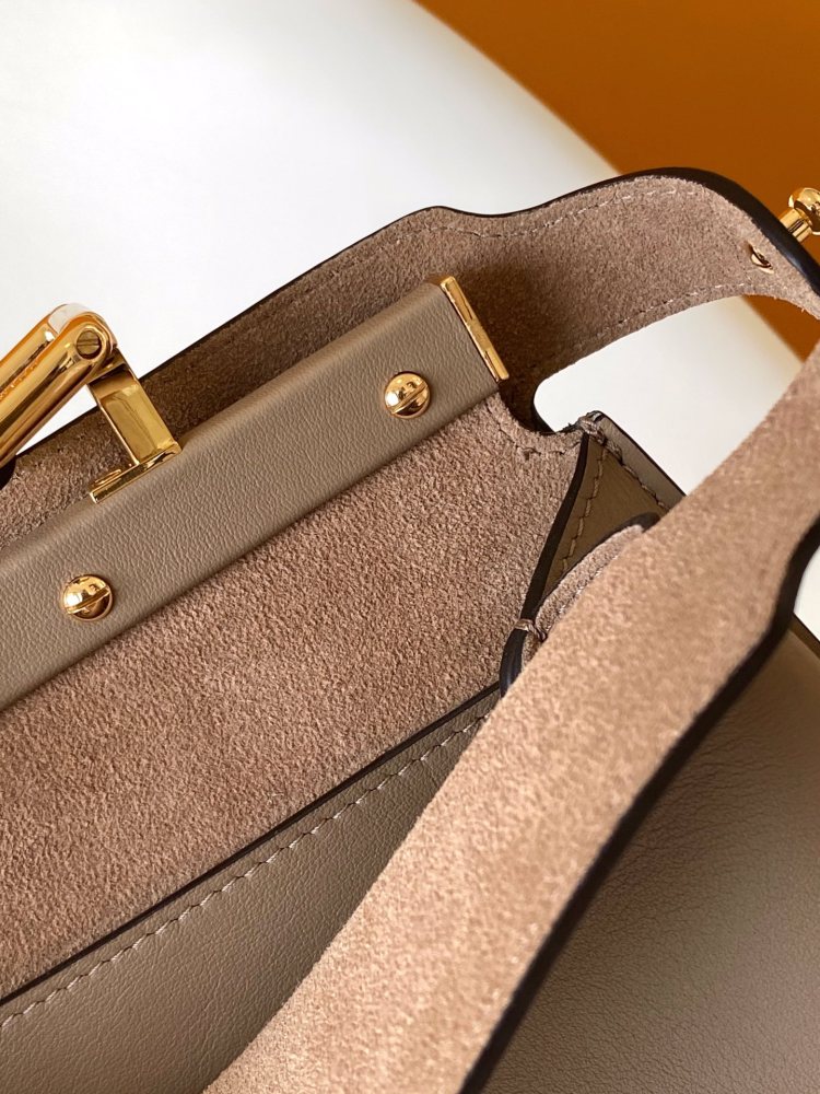 The Fendi Peekaboo medium-sized handbag (elephant grey) is the brand's iconic "little monster" bag.