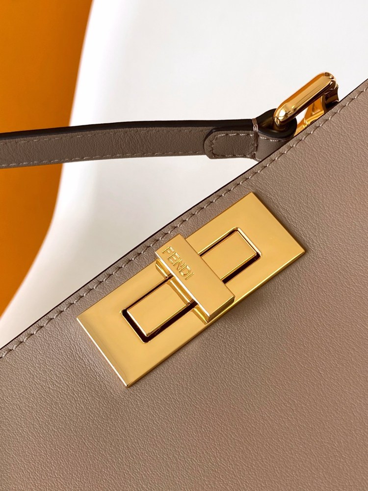 The Fendi Peekaboo medium-sized handbag (elephant grey) is the brand's iconic "little monster" bag.