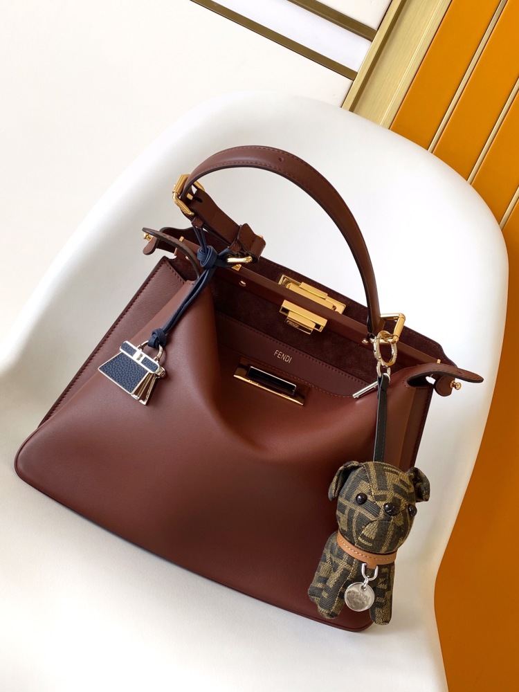 The Fendi Peekaboo medium-sized handbag (chocolate brown/dark brown) is an upgraded version of the brand's iconic "little monster" bag.