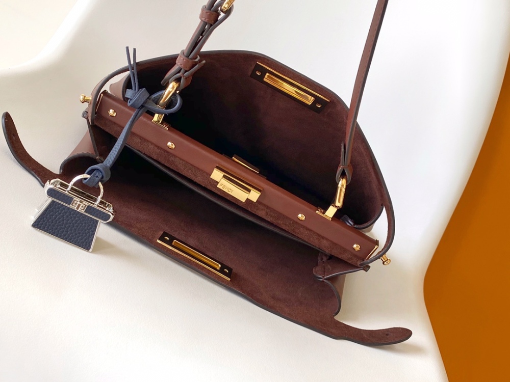 The Fendi Peekaboo medium-sized handbag (chocolate brown/dark brown) is an upgraded version of the brand's iconic "little monster" bag.