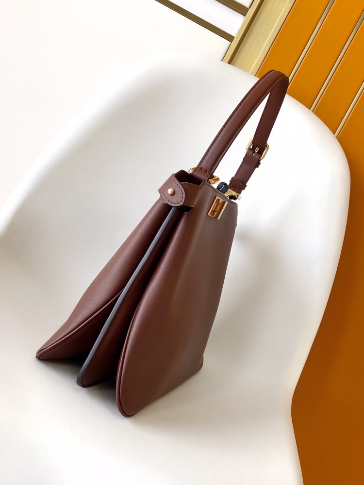 The Fendi Peekaboo medium-sized handbag (chocolate brown/dark brown) is an upgraded version of the brand's iconic "little monster" bag.