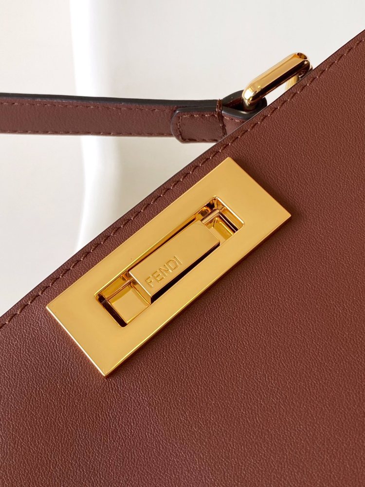 The Fendi Peekaboo medium-sized handbag (chocolate brown/dark brown) is an upgraded version of the brand's iconic "little monster" bag.