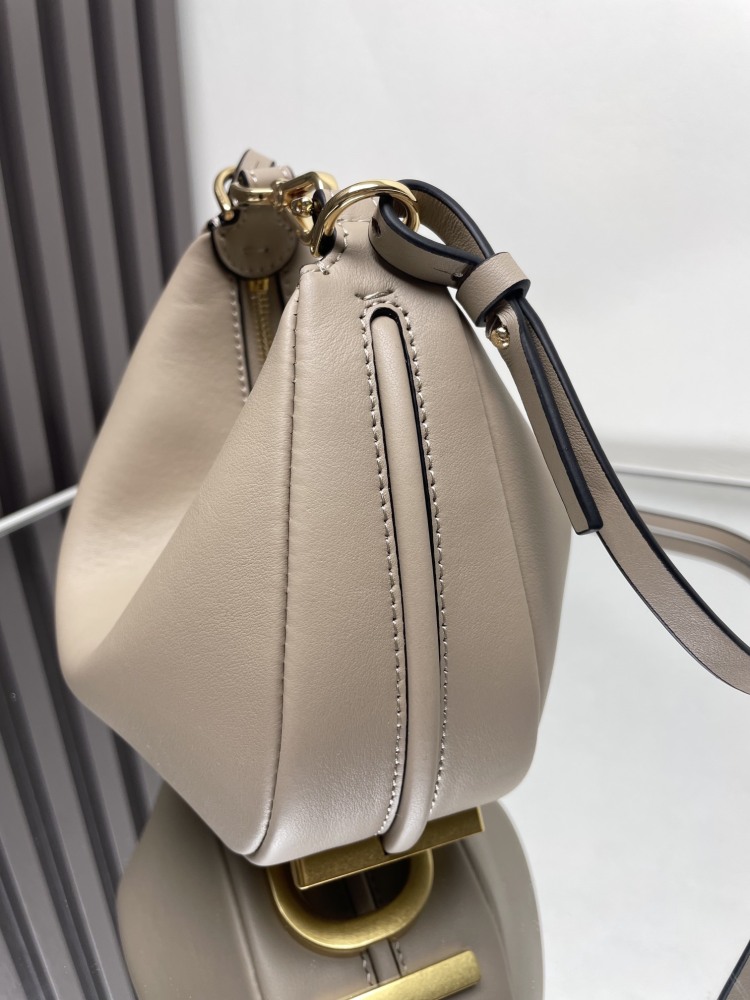 The Fendi Fendigraphy mini hobo shoulder bag (elephant grey) is a popular crescent-shaped bag from the brand in recent years.