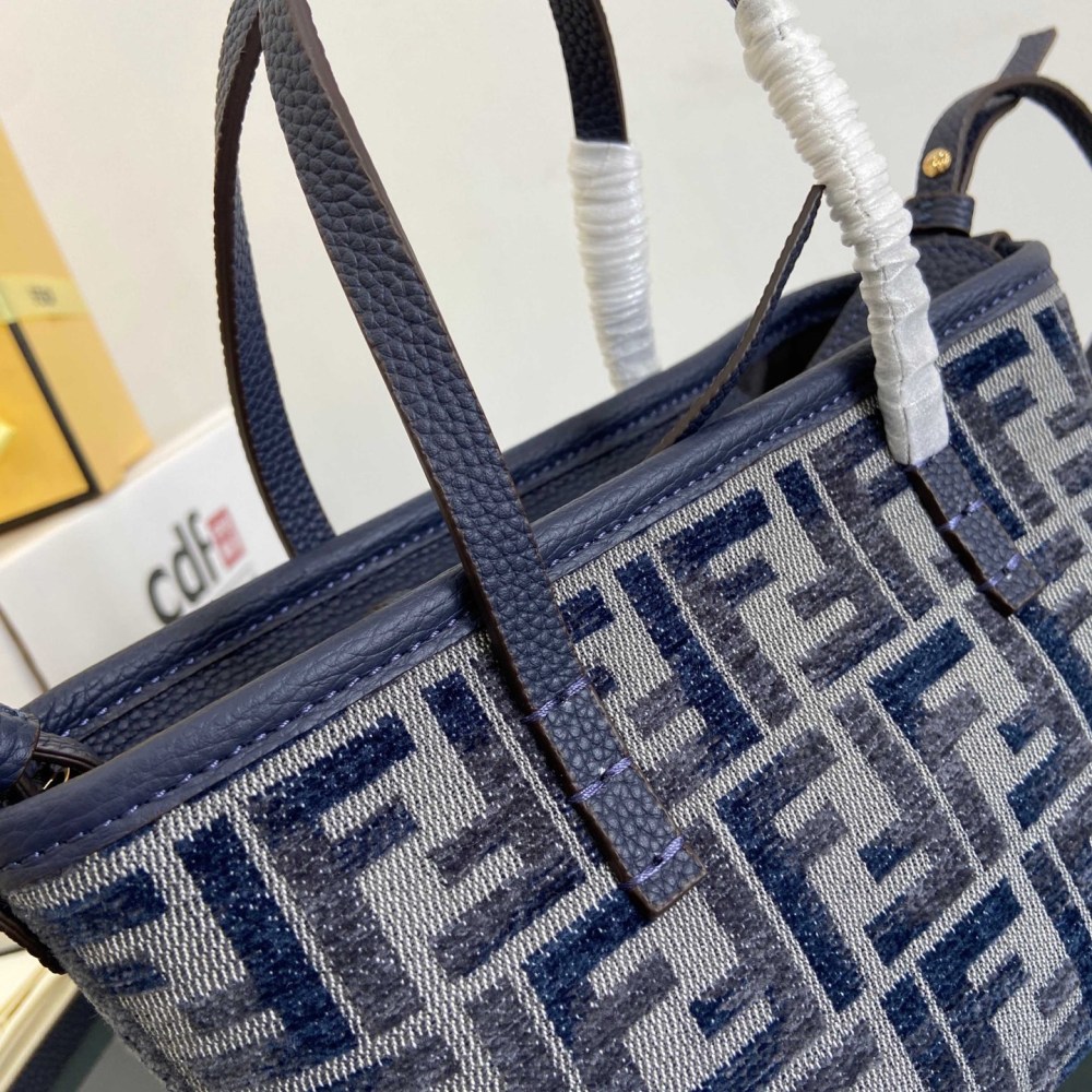 The Fendi Roll mini tote bag (FF denim monogram version) is a super popular "mini bucket" commuter bag from the brand in recent years.