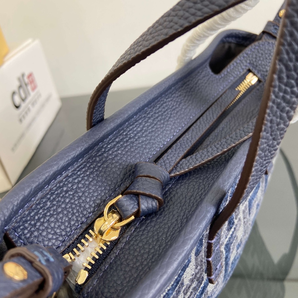 The Fendi Roll mini tote bag (FF denim monogram version) is a super popular "mini bucket" commuter bag from the brand in recent years.