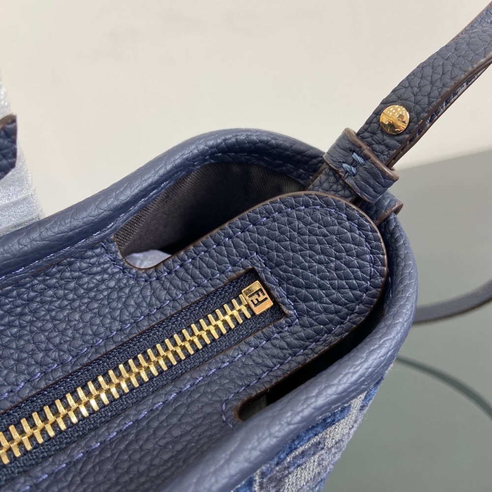 The Fendi Roll mini tote bag (FF denim monogram version) is a super popular "mini bucket" commuter bag from the brand in recent years.