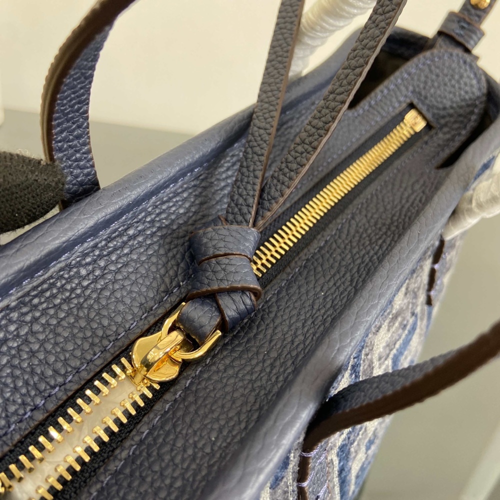 The Fendi Roll mini tote bag (FF denim monogram version) is a super popular "mini bucket" commuter bag from the brand in recent years.