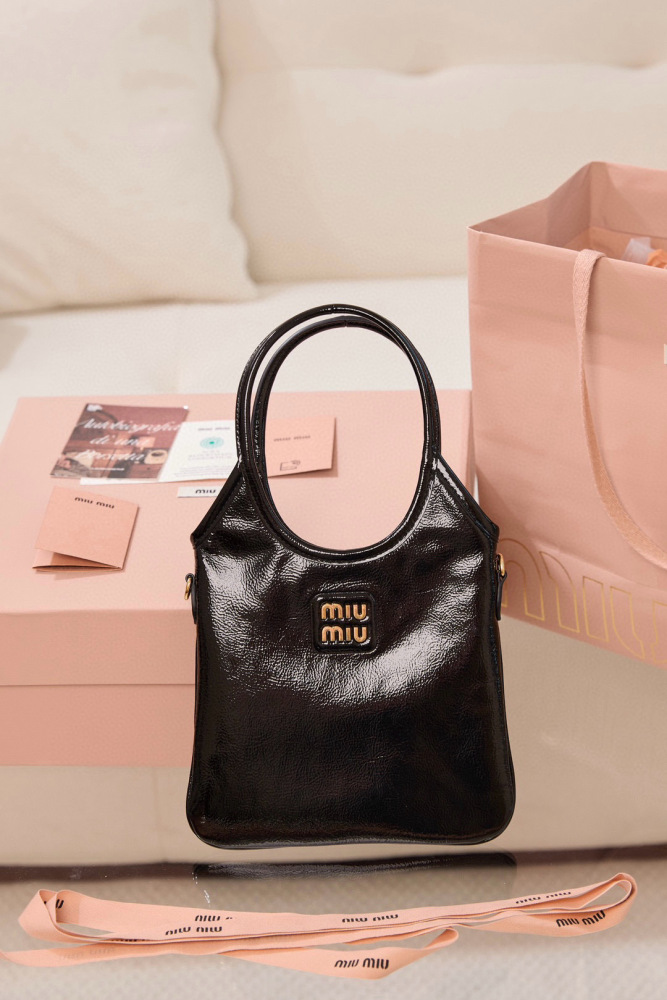 The Miu Miu Glossy Leather Handbag (Item No. 5BA327—often referred to as the "Small Hobo / Tote") is one of the brand's popular retro-style shoulder bags of recent years.