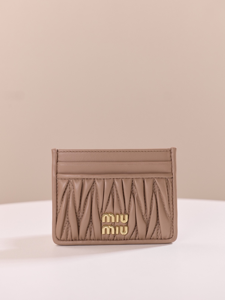 The Miu Miu Matelassé Quilted Leather Cardholder (Item No. 5MC076) is a classic accessory from the brand.
