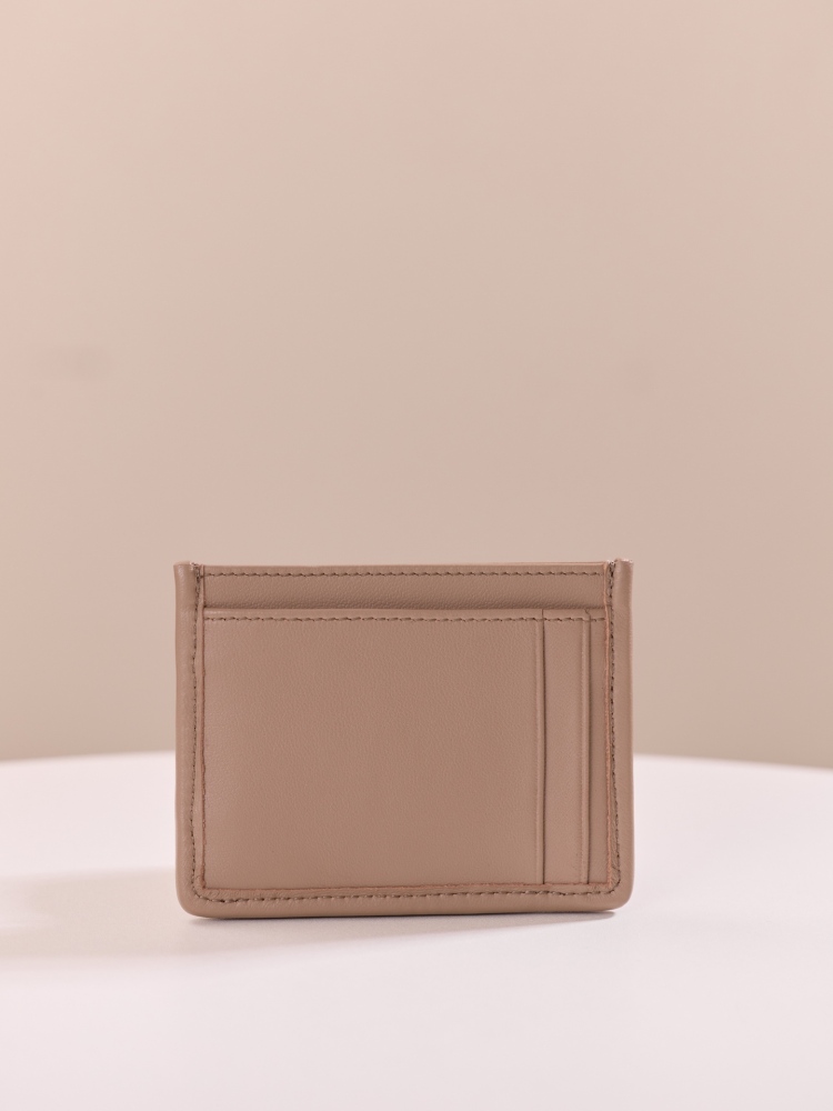 The Miu Miu Matelassé Quilted Leather Cardholder (Item No. 5MC076) is a classic accessory from the brand.