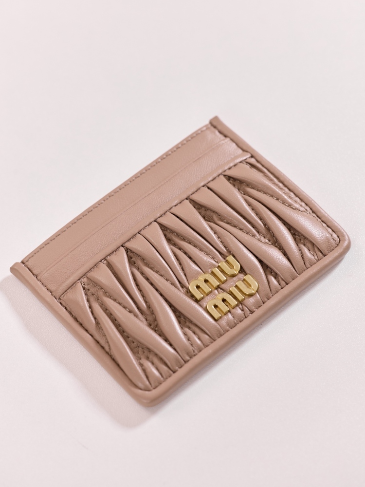 The Miu Miu Matelassé Quilted Leather Cardholder (Item No. 5MC076) is a classic accessory from the brand.