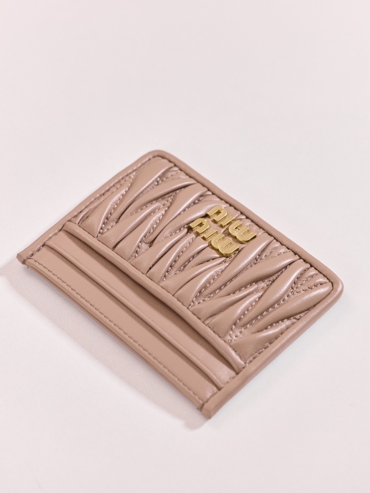 The Miu Miu Matelassé Quilted Leather Cardholder (Item No. 5MC076) is a classic accessory from the brand.