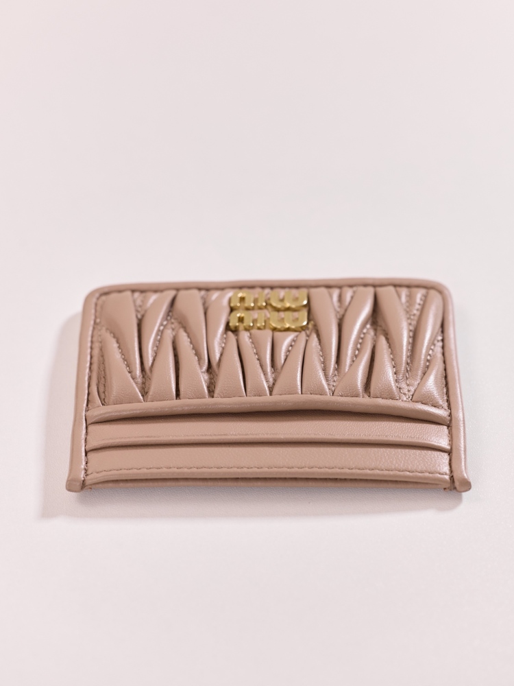 The Miu Miu Matelassé Quilted Leather Cardholder (Item No. 5MC076) is a classic accessory from the brand.