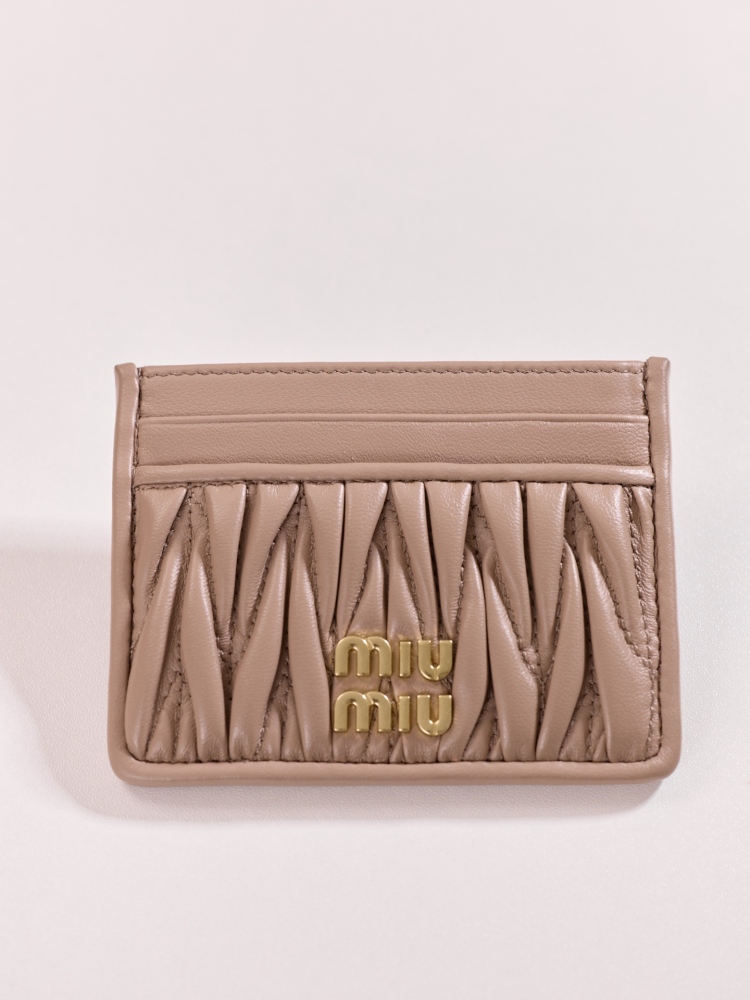 The Miu Miu Matelassé Quilted Leather Cardholder (Item No. 5MC076) is a classic accessory from the brand.