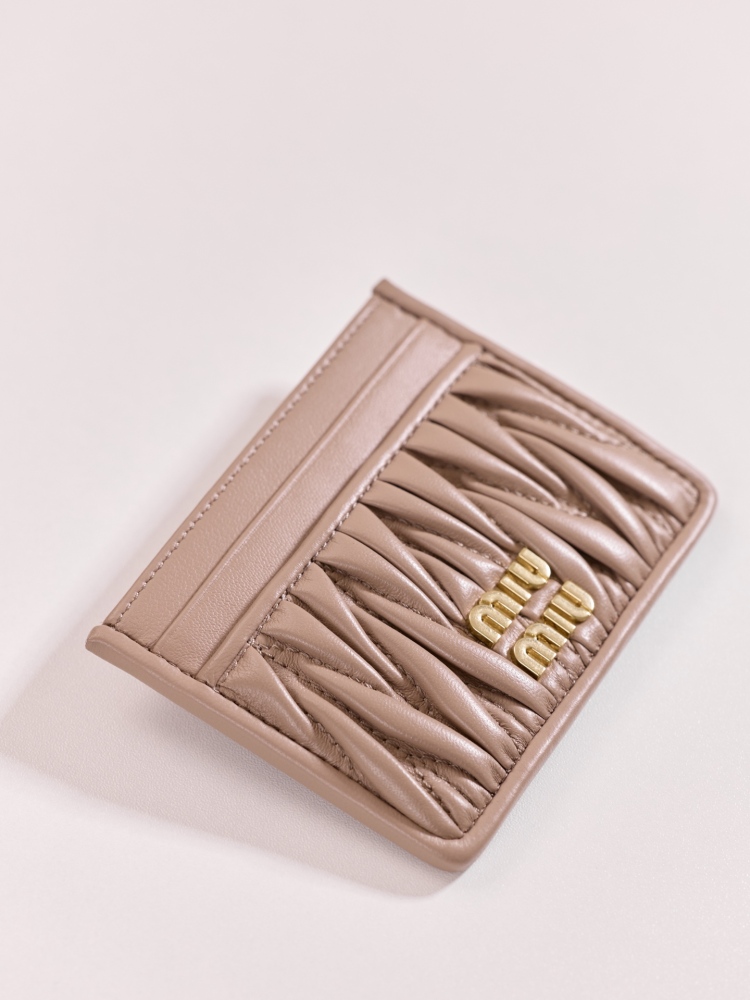 The Miu Miu Matelassé Quilted Leather Cardholder (Item No. 5MC076) is a classic accessory from the brand.