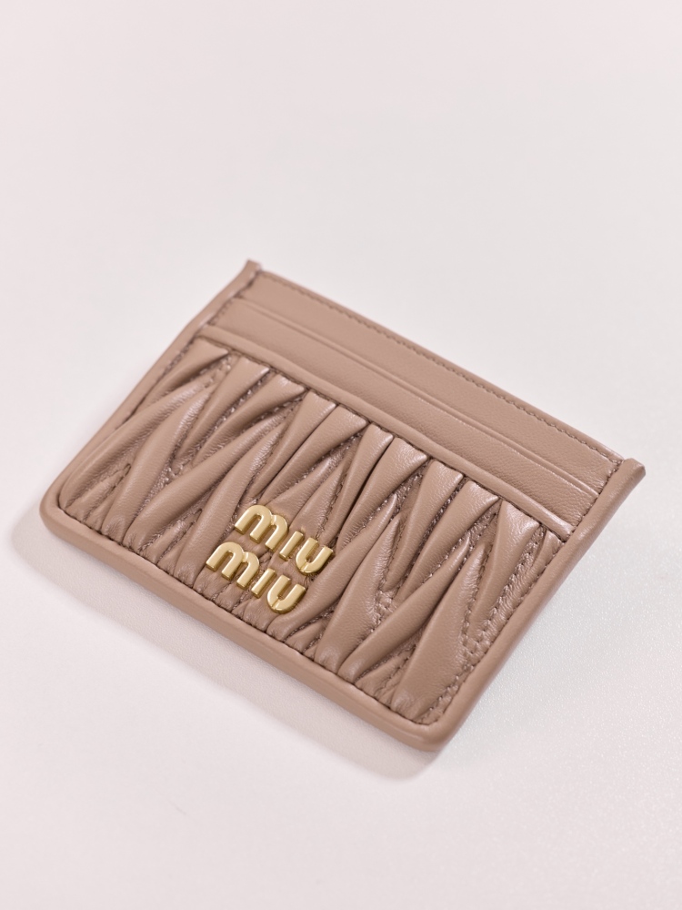 The Miu Miu Matelassé Quilted Leather Cardholder (Item No. 5MC076) is a classic accessory from the brand.