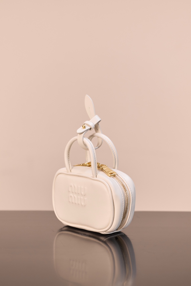 The Miu Miu Arcadie series mini leather handbag (also known as the "Extra-Small / Mini Bowling Bag") has been one of the brand's most popular styles in recent years.