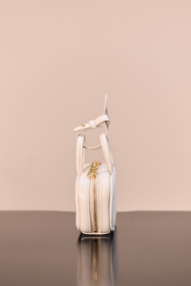 The Miu Miu Arcadie series mini leather handbag (also known as the "Extra-Small / Mini Bowling Bag") has been one of the brand's most popular styles in recent years.