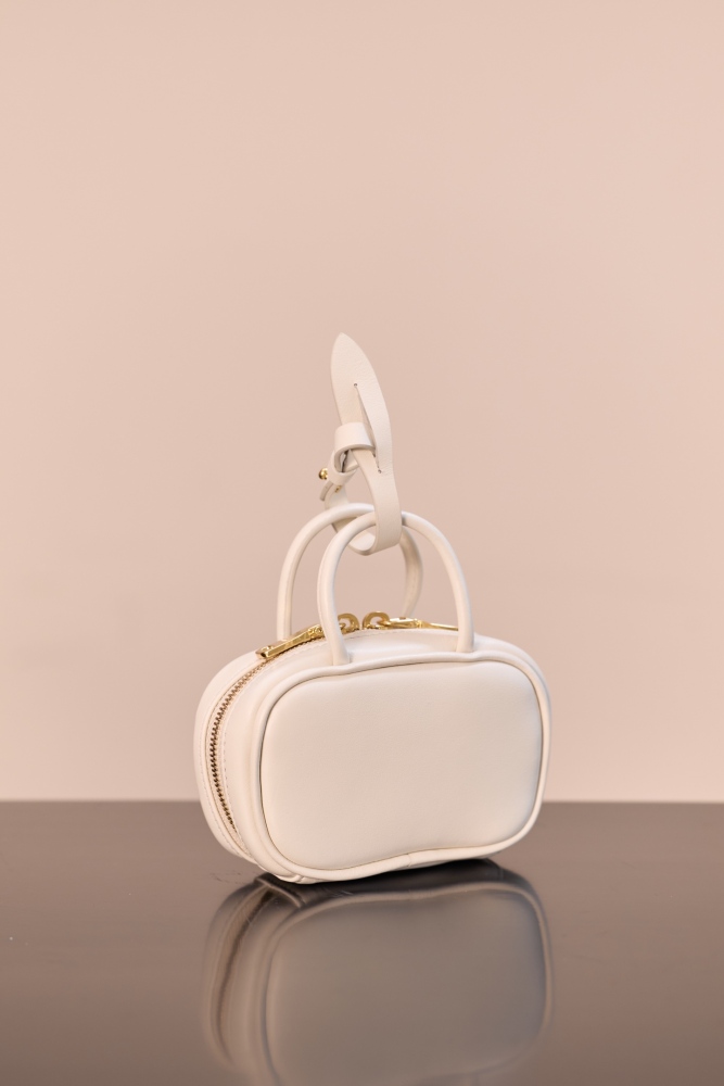 The Miu Miu Arcadie series mini leather handbag (also known as the "Extra-Small / Mini Bowling Bag") has been one of the brand's most popular styles in recent years.