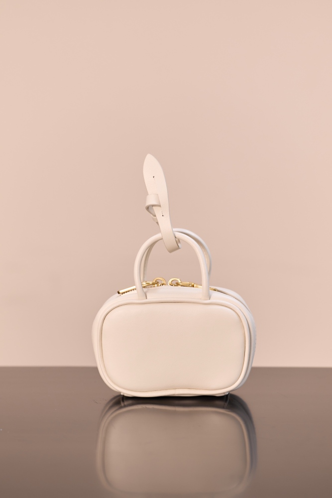 The Miu Miu Arcadie series mini leather handbag (also known as the "Extra-Small / Mini Bowling Bag") has been one of the brand's most popular styles in recent years.
