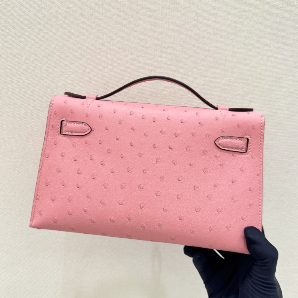 The Hermès Mini Kelly I (also known as the Kelly Pochette) Ostrich Leather Handbag is one of the brand's classic exotic leather models.